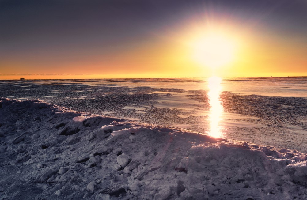 Sunrise over a frozen lake